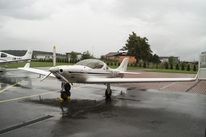 Sad aircraft waiting in the rain