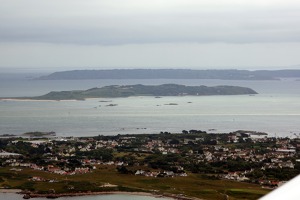 Channel islands - the closest is  Guernsey, Sark in the middle and Jersey at the top