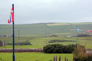 Orkney flag in the front, Scottish flag in the back