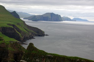 View of Vagar island with Kotlur a  Hestlur islands in the back