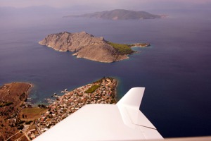 The tip of Perdika town - Aegina, with Moni in the middle and Aegistri in the back